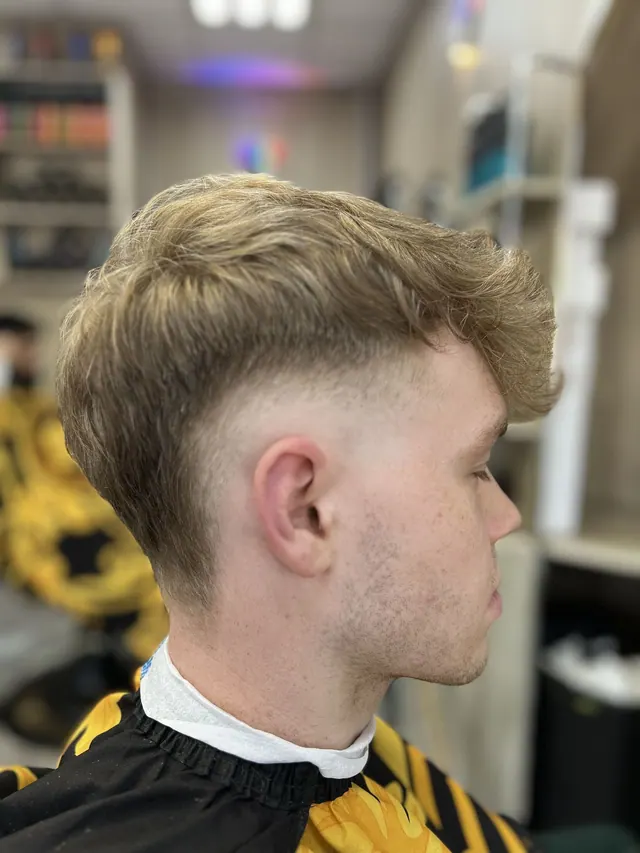 A textured quiff with a drop fade
