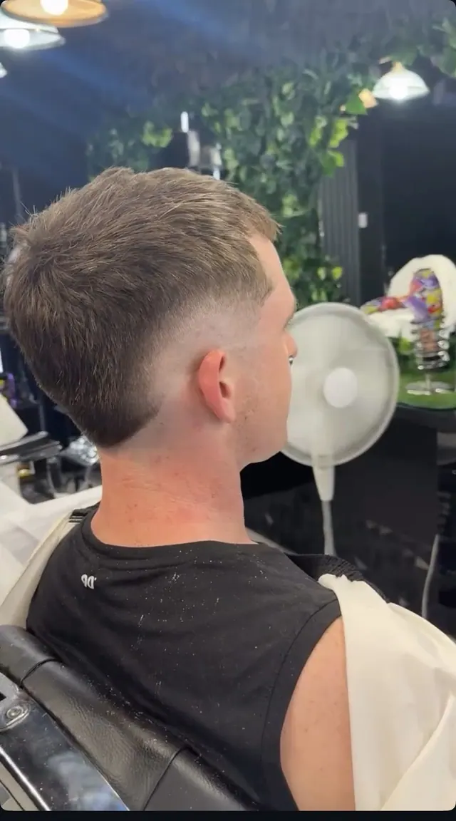 A taper fade, from behind